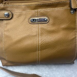 Ladies shoulder strap Tan Rossetti purse.